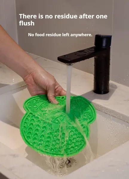Lick mat suction cups gripping a smooth tile surface
